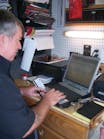 Bill Jaynes rings up a sale using a customer's credit card.